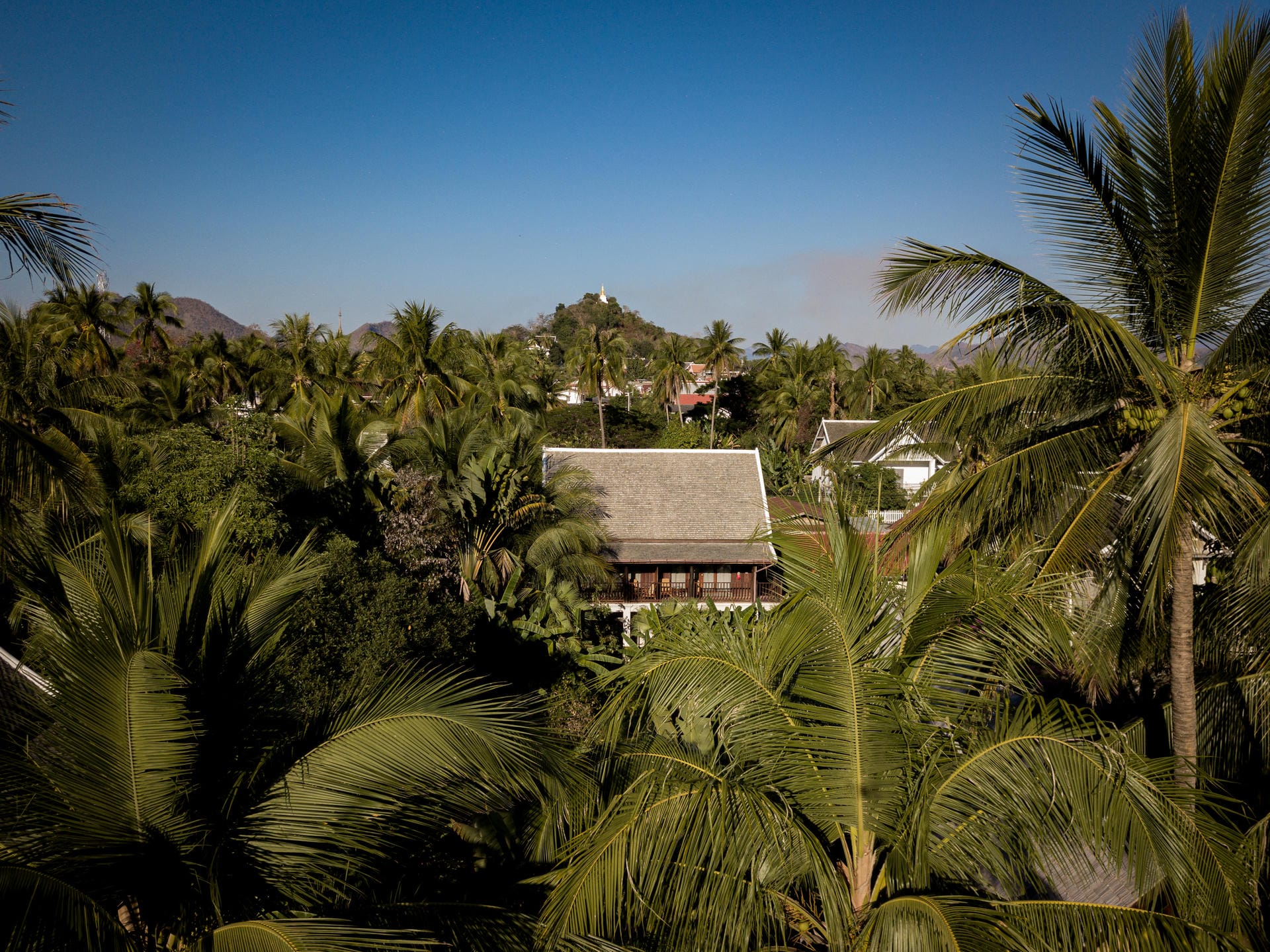 Aerial view of Maison Dalabua surrounded by lotus ponds